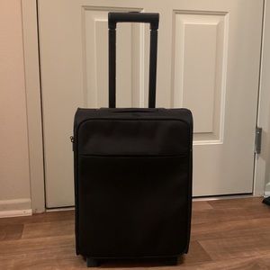 All black carry-on from Muji (17.9x12.6x8.1 inches), perfect for 1-2 day trip